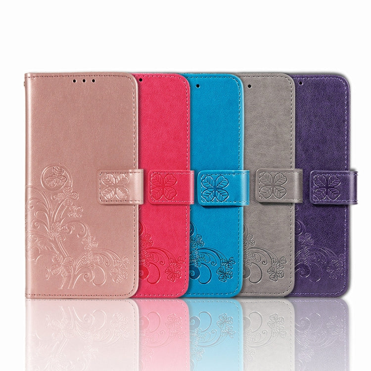 Para Motorola E7 Potencia Cierre de cuatro hojas Hebilla en relieve Protección de teléfono móvil Funda de cuero con cordón y ranura para tarjeta y función de billetera y soporte (azul)